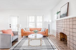 a living room with a couch and a table at Mid-Century Modern 2B Oakley with Fenced Yard and Offstreet Parking in Cincinnati