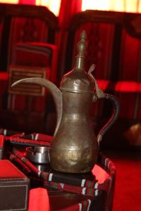 a metal tea kettle sitting on a table at Petra fort hotel in Wadi Musa