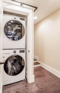 a laundry room with a washer and dryer at Artist Gallery Downtown 2Bed 2Bath Condo in Cincinnati