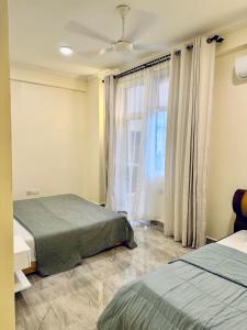 En eller flere senger på et rom på SEA-VIEW 3-Bedroom/5-BEDS-APT