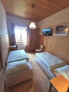 Letto o letti in una camera di Garni Tschutscherhof