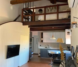 A kitchen or kitchenette at TUSCANY LOFT IN THE CITY