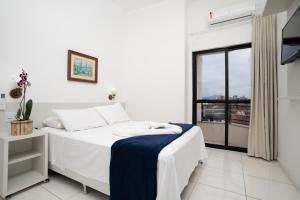 Cama o camas de una habitación en Boulevard Central Canasvieiras Hotel