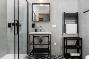 a bathroom with a sink and a shower at Klimczok Apartamenty in Bystra +27 photos