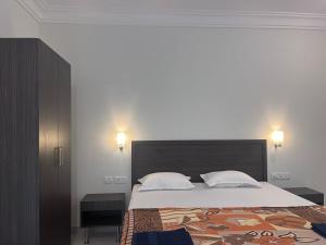 Letto o letti in una camera di Morjim Sunset Hotel