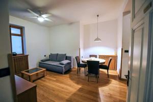 a living room with a couch and a table and chairs at -New- Apartment Nara -Heart of Opatija- in Opatija