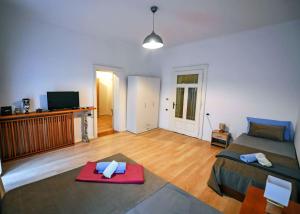 a living room with a bed and a red mat at -New- Apartment Nara -Heart of Opatija- in Opatija