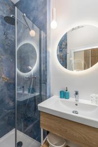 a bathroom with a sink and a shower at Rent like home - Bel Mare F527 in Międzyzdroje