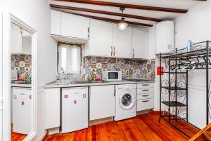 A cozinha ou kitchenette de Splendid Apartament Alfama-Center