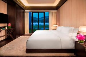Voodi või voodid majutusasutuse Banyan Tree Huangshan toas