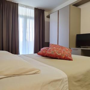 Postel nebo postele na pokoji v ubytování Casaalbergo La Rocca