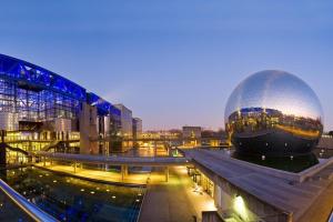 a building with a large ball on top of it at Grand F3 Paris Stade de France & La Villette, 6 pers - Metro 7 in Aubervilliers