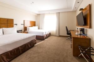 Кровать или кровати в номере Crowne Plaza Asunción by IHG
