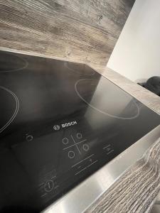 a close up of a stove top oven at Ciao Lilla Apartman in Keszthely +47 photos