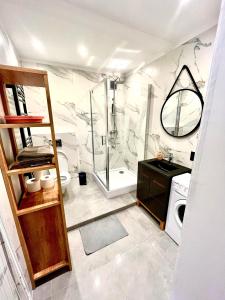 a bathroom with a shower and a toilet and a sink at Pokoje Gościnne Wiślna in Krakow +51 photos