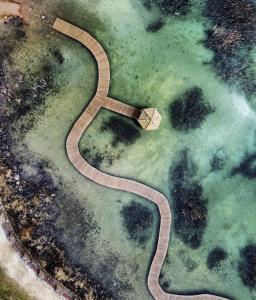 an aerial view of a serpentine road in a field at Mieszkaj U Marty w GRÓDKU in Jaworzno