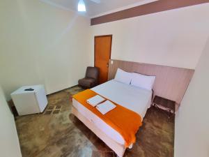 Ένα ή περισσότερα κρεβάτια σε δωμάτιο στο POUSADA POR DO SOL