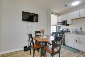 a kitchen and dining room with a table and chairs at Cozy Maryland Getaway in the Heart of Baltimore! in Baltimore