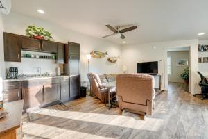 a kitchen and living room with a table and a couch at Pet-Friendly White Pigeon Apartment with Fire Pit! in White Pigeon