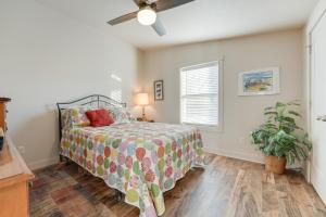 a bedroom with a bed and a ceiling fan at Pet-Friendly White Pigeon Apartment with Fire Pit! in White Pigeon