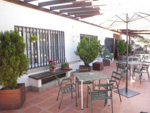 Reštaurácia alebo iné gastronomické zariadenie v ubytovaní Hostal Siete Picos