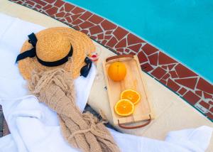 a teddy bear in a towel next to a tray of oranges at King Suite Apt With Shared Pool 02 in Clearwater