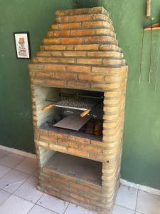 a brick oven with some food inside of it at Casa Oceano in Marechal Deodoro