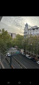 a city street with cars parked in front of a building at Salamanca Views in Madrid
