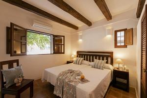 Posteľ alebo postele v izbe v ubytovaní Can Noves - Villa de 5 suites 28 y 58