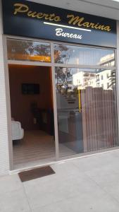 a store front of a store with a glass door at RESIDENCE PUERTO MARINA Corniche d'Asilah in Asilah