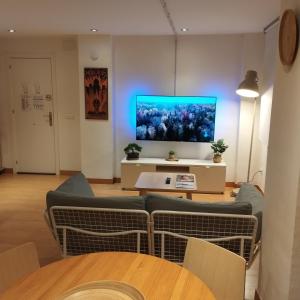 A television and/or entertainment centre at Leon Riverside Flat