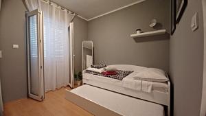 Postel nebo postele na pokoji v ubytování Apartments 255
