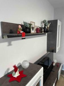 a kitchen with a counter with a red star on it at Hochwertige Ferienwohnung im Bauernhaus in Freital +7 photos