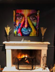 a painting of a man over a fireplace at Estremoz Hotel in Estremoz