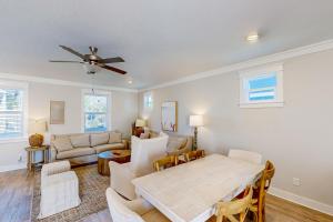 a living room with a table and a couch at Home Sweet San Blas in Cape San Blas