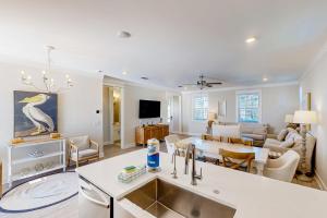 a kitchen and living room with a table and a living room at Home Sweet San Blas in Cape San Blas