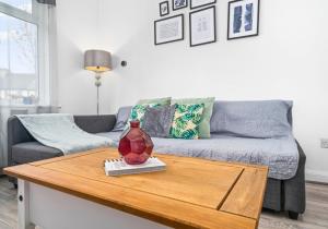 a living room with a couch and a table at Anderson Apartment by Klass Living Motherwell in Motherwell