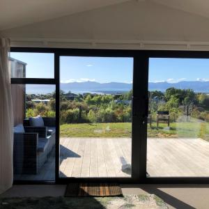 a view from the living room of a house at Ruby Bay Loft Apartment in Nelson