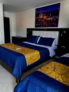 Postel nebo postele na pokoji v ubytování Hotel Casa Modelia