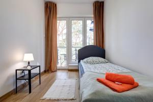 Posteľ alebo postele v izbe v ubytovaní Poddąbek Comfort I Apartamenty z tarasem na dachu, ogródkiem, basenem zewnętrznym i wewnętrznym, salą zabaw i animacjami