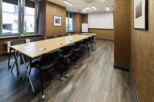 a conference room with a long table and chairs at Hotel Logos Kraków in Krakow