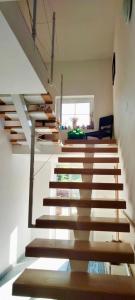 a staircase in a house with wooden steps at Apartmány Maňová 