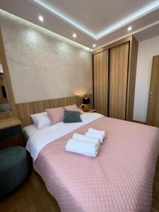 Postel nebo postele na pokoji v ubytování Perla Lux 2 Apartments