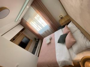 Postel nebo postele na pokoji v ubytování Perla Lux 2 Apartments