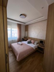 Postel nebo postele na pokoji v ubytování Perla Lux 2 Apartments