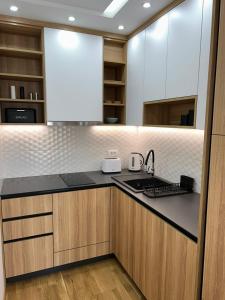Kuchyň nebo kuchyňský kout v ubytování Perla Lux 2 Apartments