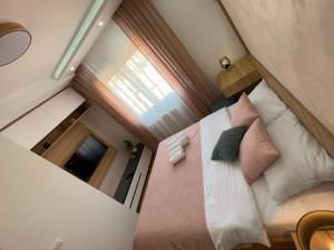 Postel nebo postele na pokoji v ubytování Perla Lux 2 Apartments
