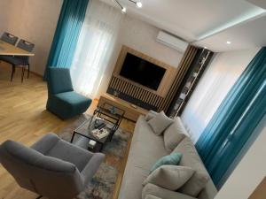TV a/nebo společenská místnost v ubytování Perla Lux 2 Apartments