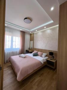 Postel nebo postele na pokoji v ubytování Perla Lux 2 Apartments