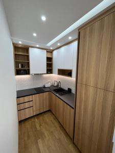 Kuchyň nebo kuchyňský kout v ubytování Perla Lux 2 Apartments